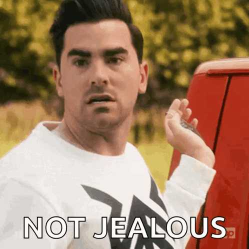 Man In White Shirt Beside Red Van Not Jealous GIF