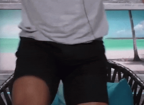 Man in White Shirt Black Shorts Before Chair