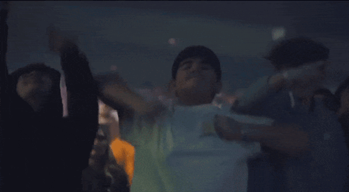 Man in White Shirt Dancing in Dark Room