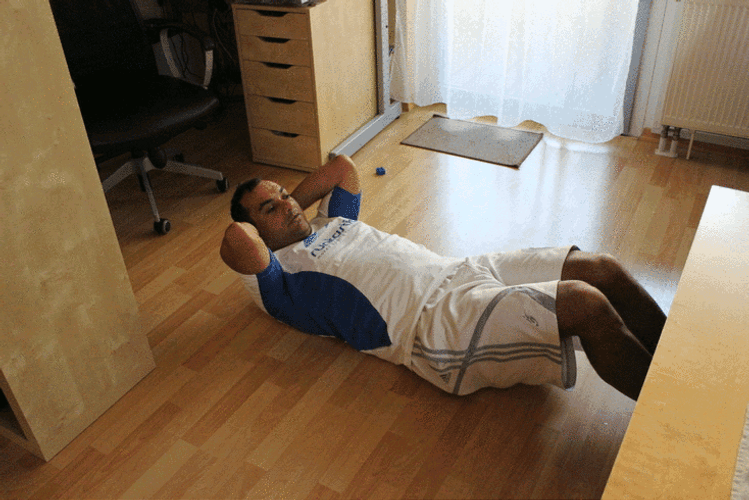Man In White Shirt Doing Crunches Exercise GIF