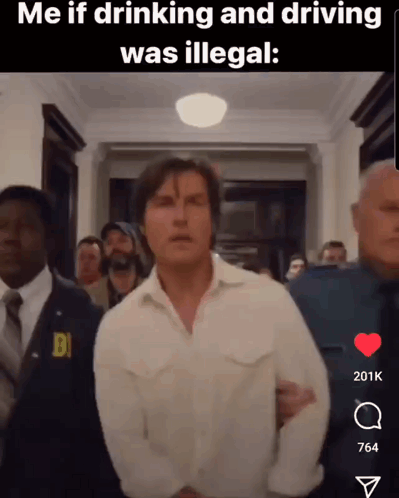 Man in White Shirt Escorted by Police Officer in Hallway