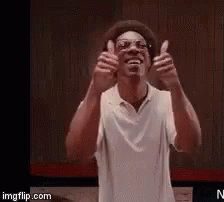 Man in White Shirt Giving Thumbs Up
