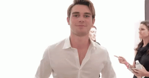 Man In White Shirt Giving Two Thumbs Up With Group GIF