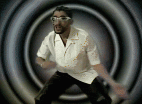 Man in White Shirt Glasses Dancing Dark Room