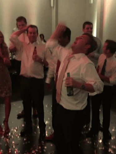 Man in White Shirt Holding Beer
