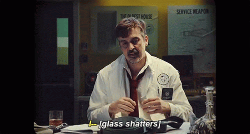 Man in White Shirt Holding Glass