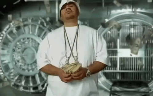 Man in White Shirt Holding Money