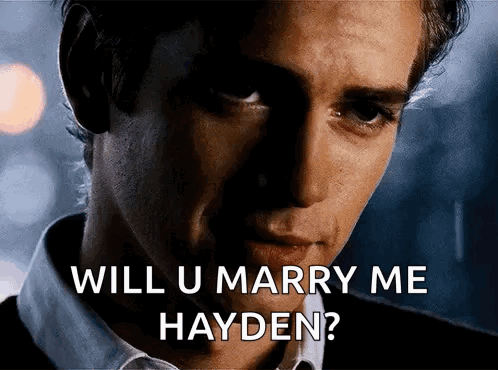 Man In White Shirt Holding Pink Container With Hayden Mi Amor GIF