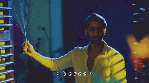 Man in White Shirt Holding String Toree