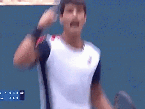 Man In White Shirt Holding Tennis Racquet GIF
