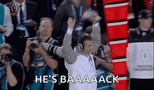 Man in White Shirt Holding Trophy Says Baaaack