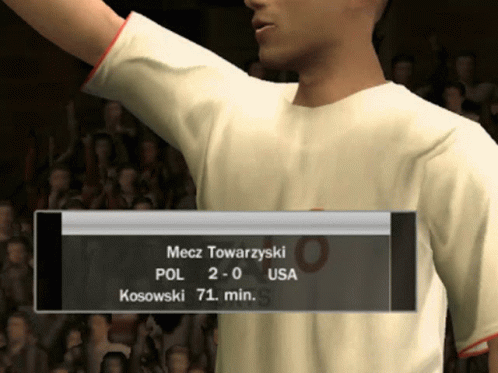 Man in White Shirt in Front of Scoreboard Mecz Towarzynski