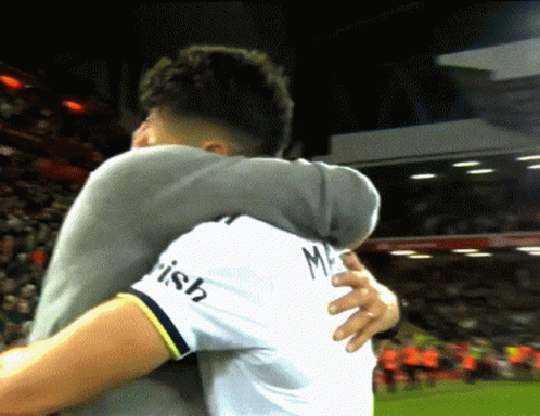 Man in White Shirt Irish Hugging Another