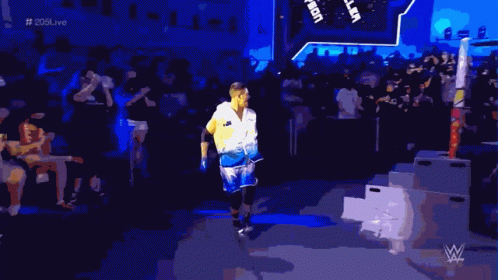 Man in White Shirt Johnson Enters Wrestling Ring