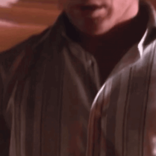Man in White Shirt Looking at Camera