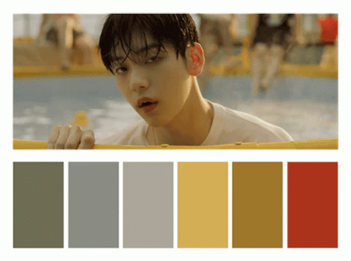 Man In White Shirt Looking Over Yellow Fence GIF