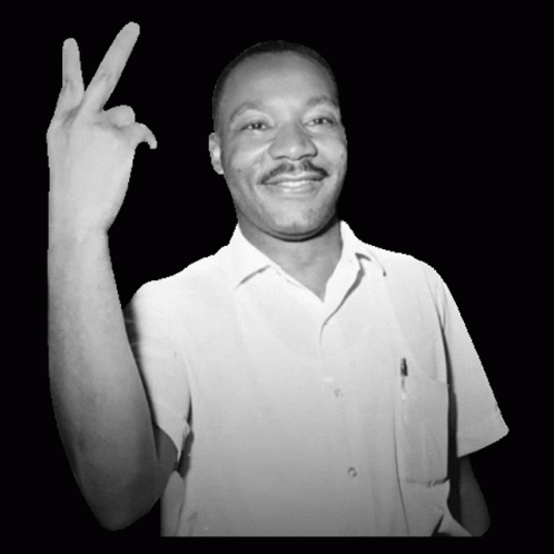 Man in White Shirt Making Peace Sign