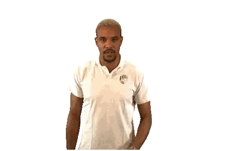 Man in White Shirt Making Silence Gesture