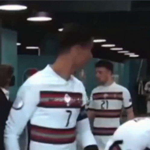 Man in White Shirt Number 7 Standing