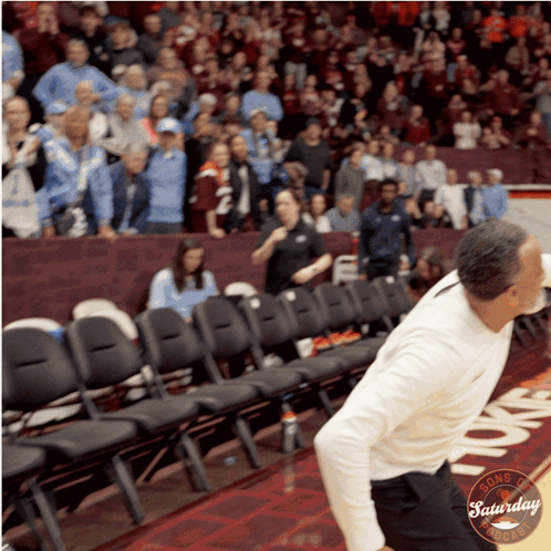 Man in White Shirt on Basketball Court Saturday Night