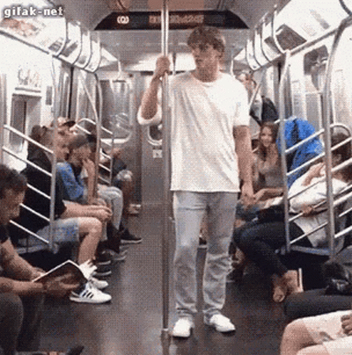 Man In White Shirt On Subway GIF