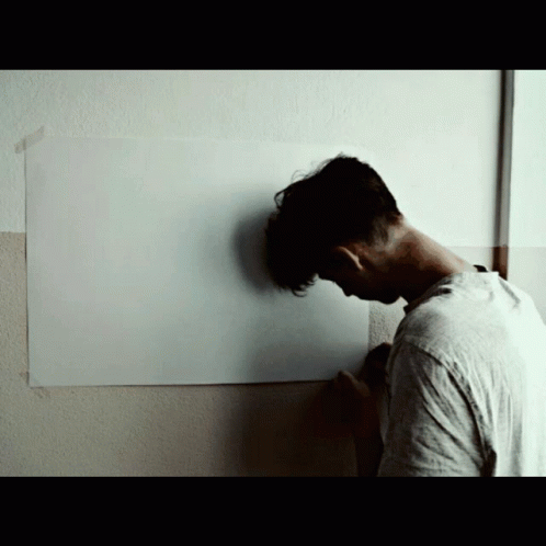 Man in White Shirt Painting Wall