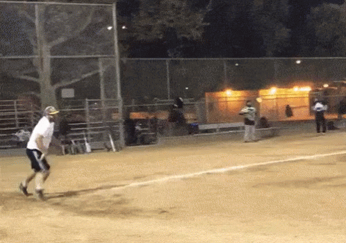 Man in White Shirt Playing Baseball