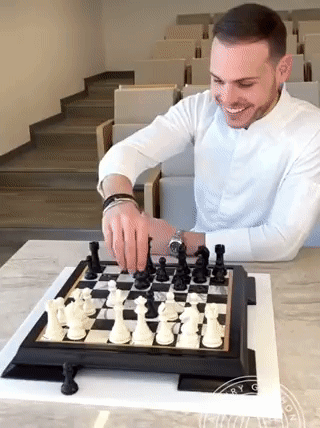 Man in White Shirt Playing Chess