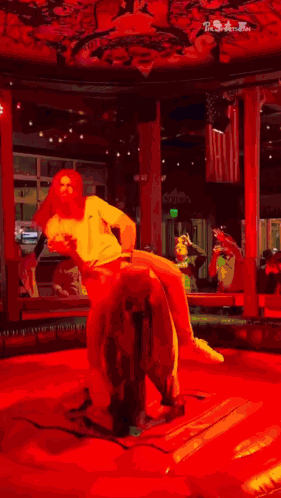 Man In White Shirt Riding Bull In Rodeo GIF
