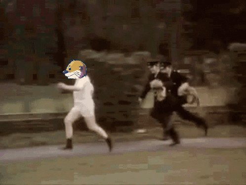 Man in White Shirt Running From Police