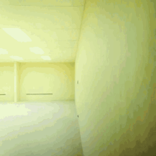 Man in White Shirt Running Through Furniture