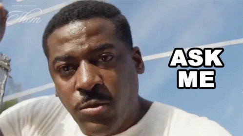 Man in White Shirt Saying Ask Me