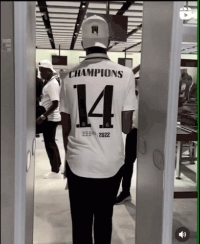 Man in White Shirt Saying Champions 14