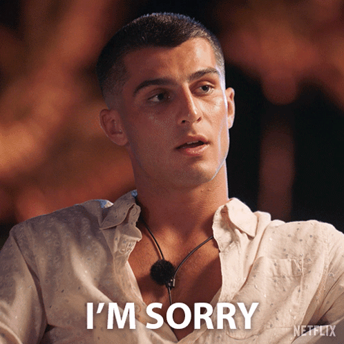 Man in White Shirt Saying I'm Sorry