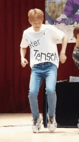 Man in White Shirt Saying Peter Tensen Dancing on Stage