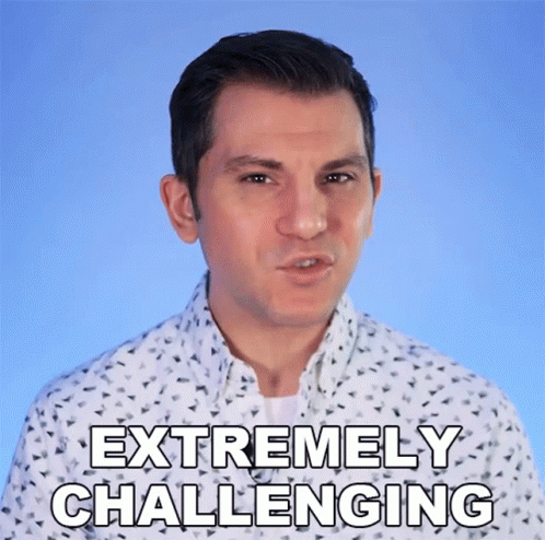 Man in White Shirt Says Extremely Challenging on Blue Background