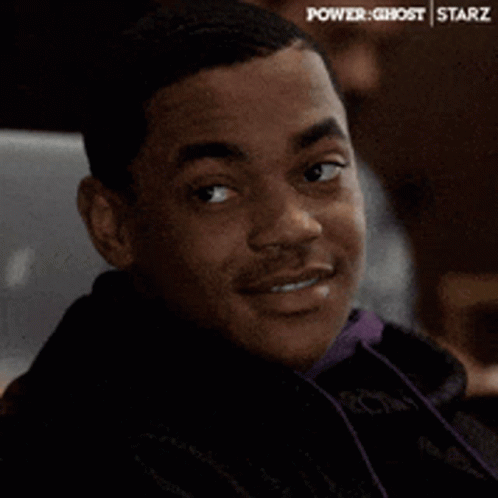 Man In White Shirt Sitting Saying Enter The Dragon GIF