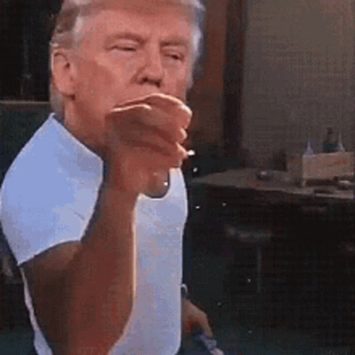 Man in White Shirt Smoking and Pointing