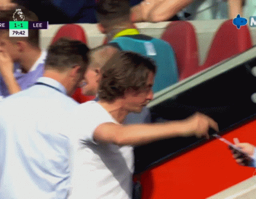 Man In White Shirt Standing Before Lee Screen GIF