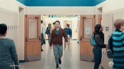 Man In White Shirt Standing By Door GIF