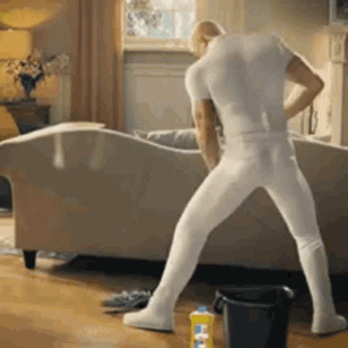 Man In White Shirt Standing On One Leg GIF