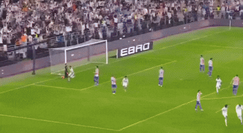 Man in White Shirt Tackled in Soccer Game