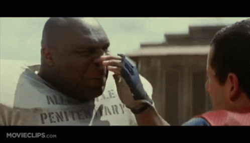 Man in White Shirt Touching Another Man's Nose Penitentiary
