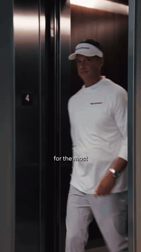 Man in White Shirt Walking Into Elevator 4