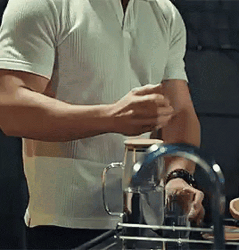Man in White Shirt Washing Dishes