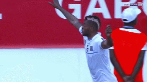 Man in White Shirt with 61 Jumping