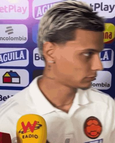 Man In White Shirt With Aguila Sign GIF