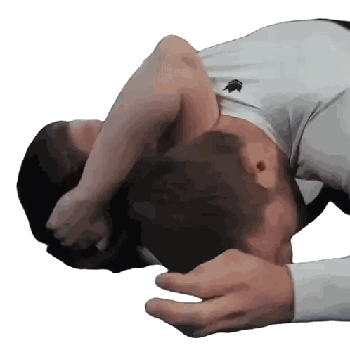 Man in White Shirt with Arrow Lying Down