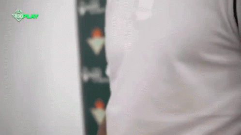 Man in White Shirt With Green Stripe
