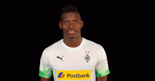 Man in White Shirt with Green-Yellow Stripe Ok